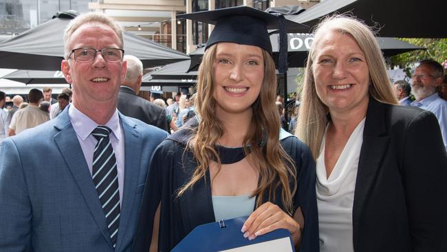 Ian, Madeleine and Simone Wright celebrate graduation. Picture: Brad Fleet