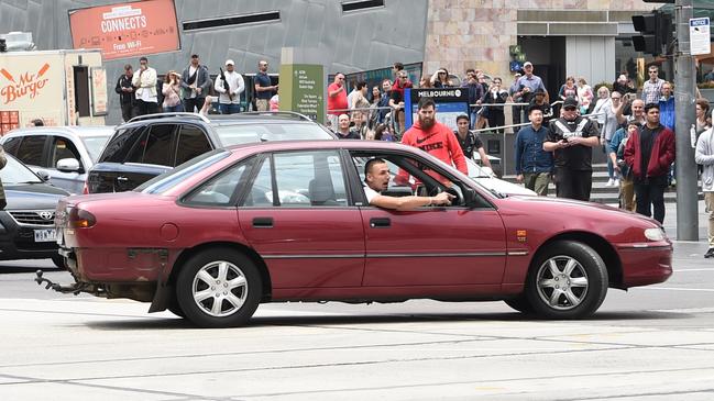 Dimitrious Gargasoulas did doughnuts on Flinders St before wreaking havoc on Bourke St. Picture: Tony Gough