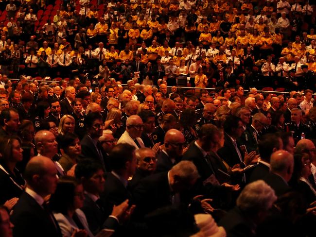 NSW Police, RFS, family members of the deceased and others impacted by the bushfires attend the State Memorial Service on Sunday. Picture: Cameron Spencer/Getty