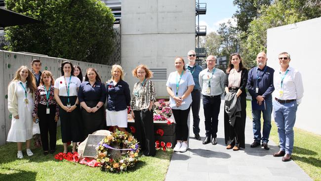 Members of the Optus United Employee Network and Optus team members at the Optus Remembrance Garden in Sydney.