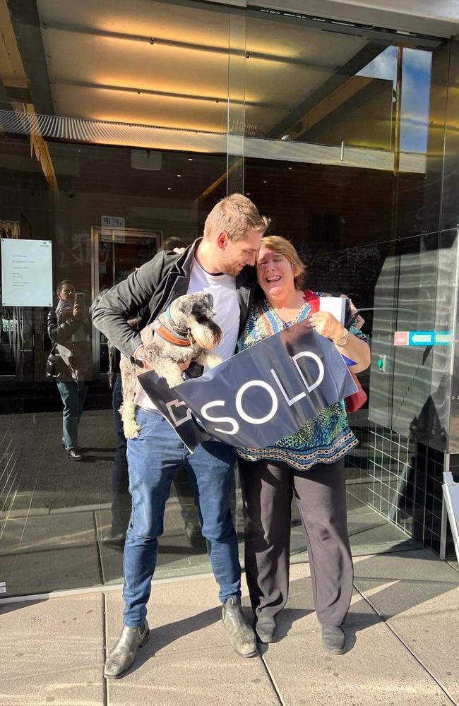 Sanders and his mum celebrate buying a home after his business took off. Picture: Supplied