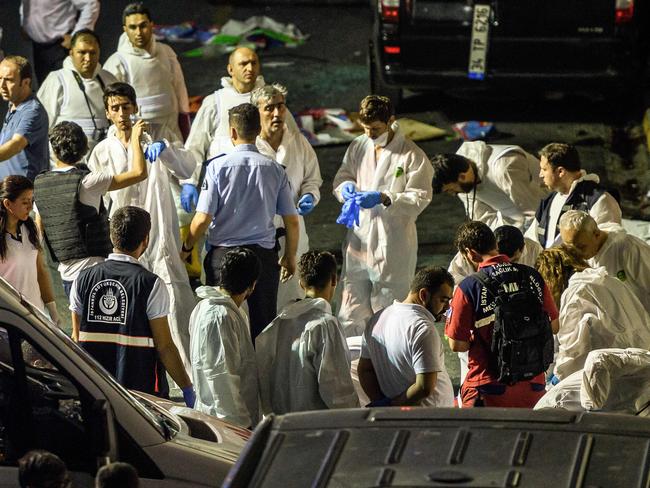 Forensic police pictured at the explosion site at Ataturk airport which has now resumed business. Picture: AFP/OZAN KOSE