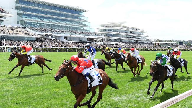 Tim Clark riding Kaizad wins the Network 10 Carbine Club Stakes. Photo by Quinn Rooney/Getty Images.