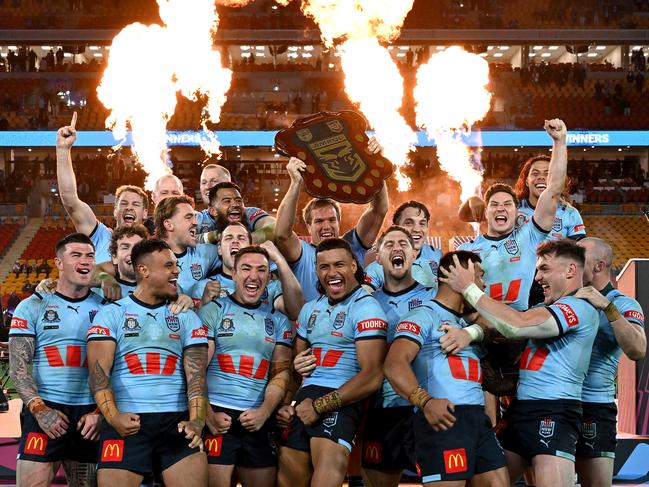 BRISBANE, AUSTRALIA - JULY 17: The New South Wales Blues celebrate victory after game three of the 2024 Men's State of Origin series between Queensland Maroons and New South Wales Blues at Suncorp Stadium on July 17, 2024 in Brisbane, Australia. (Photo by Bradley Kanaris/Getty Images)