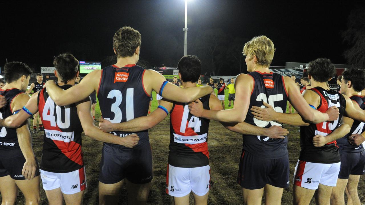 Norwood and West Adelaide players unite against racism at Norwood Oval: Picture: Michael Marschall