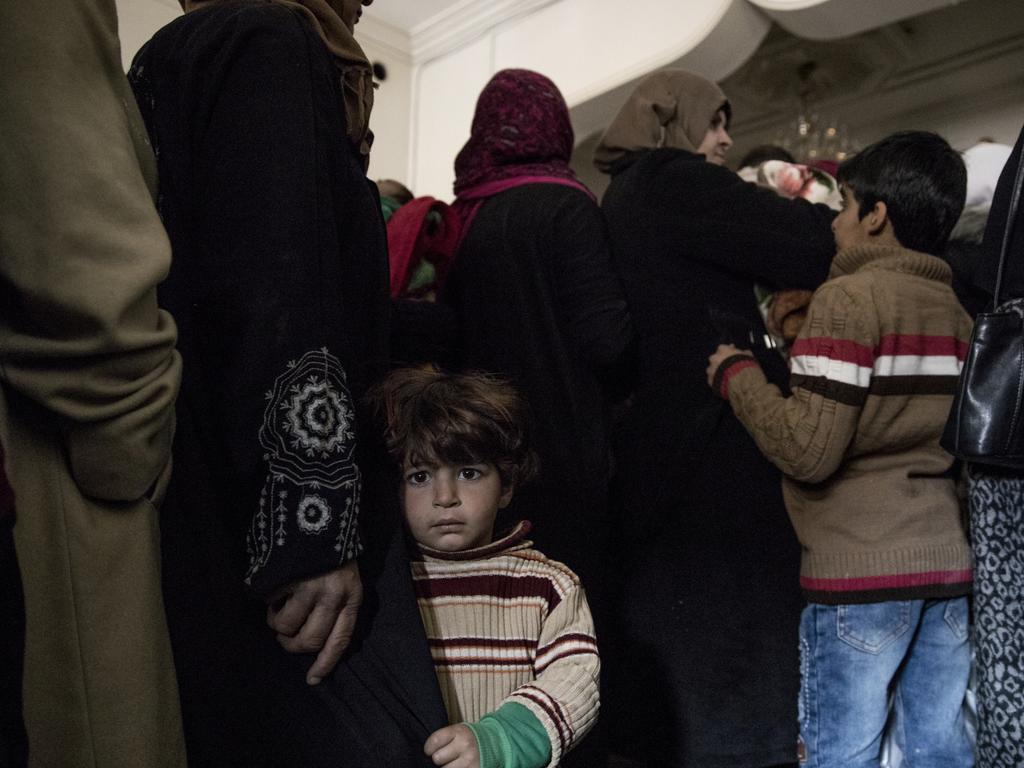 The line at a health clinic run by the Syria Arab Red Crescent in Deir ez Zor. Picture: Ella Pellegrini