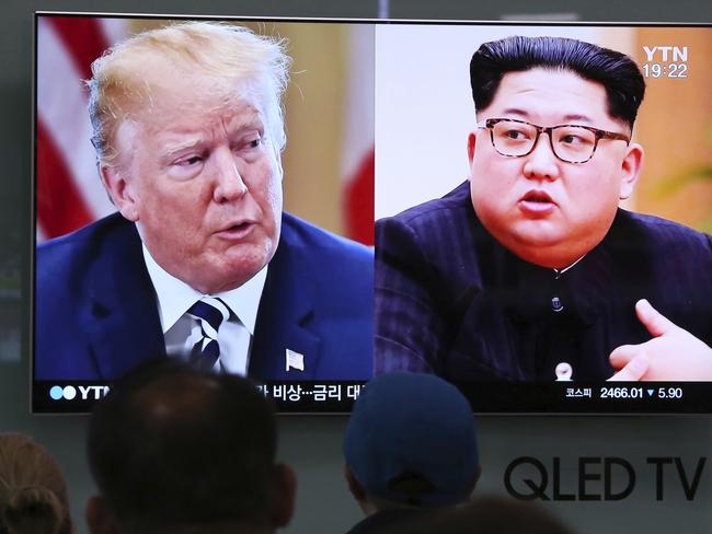 US President Donald Trump, left, and North Korean leader Kim Jong-un during a news program at the Seoul Railway Station in Seoul, South Korea. Picture: AP