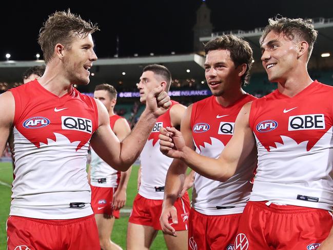 SYDNEY, AUSTRALIA - MAY 01: (L-R) LukeÃÂ Parker, OliverÃÂ Florent and RyanÃÂ Clarke of the Swans celebrate victory after the round seven AFL match between the Sydney Swans and the Geelong Cats at Sydney Cricket Ground on May 01, 2021 in Sydney, Australia. (Photo by Matt King/AFL Photos/via Getty Images)