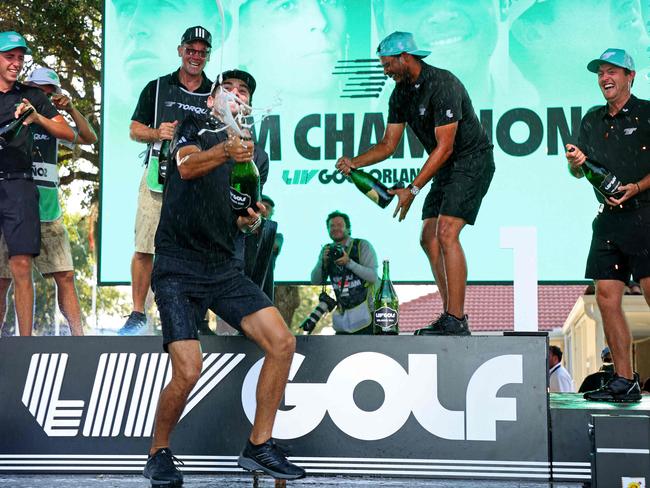 ORLANDO, FLORIDA - APRIL 02: Sebastian Munoz, Mito Pereira, Joaquin Niemann,and David Puig of Torgue GCcelebrate winning the team event at the LIV Golf Invitational - Orlando at The Orange County National on April 02, 2023 in Orlando, Florida.   Mike Ehrmann/Getty Images/AFP (Photo by Mike Ehrmann / GETTY IMAGES NORTH AMERICA / Getty Images via AFP)