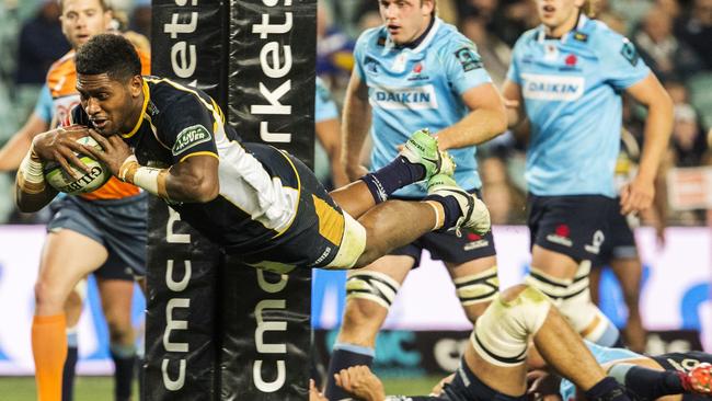 Isi Naisarani of the Brumbies launches himself over the tryline against the Waratahs on Saturday night.