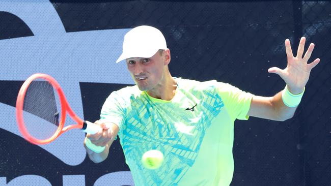 Bernard Tomic hits a forehand against Jason Kubler in the second round of the 2025 Brisbane QTC Tennis Internationals, at Tennyson, on Wednesday, January 28. Photo Steve Pohlner