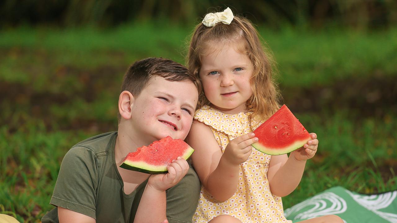 Reine and Myah Rogers-Birrell enjoy a healthy slice of watermelon. Picture: Glenn Campbell