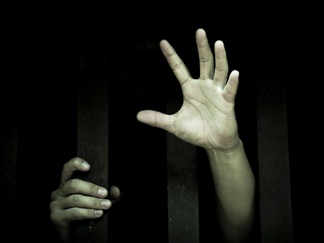 let me out, hands holding bars, green light, mental health generic, thinkstock, trapped, asylum seeker, young hands, unhappiness, sadness, depression, reaching for help, helpless