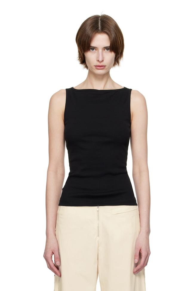 Flore FloreBlack Timmi Tank TopMaybe you can’t exactly wear a crop top to the office, but you won’t be able to go without a tank. In black, a boatneck piece like this top from Flore Flore serves as the ultimate chic tank to wear solo or layered. Style it with a pair of pleated trousers and under an open button-up for the ultimate work outfit.Type: Tank top | Material: 100 per cent organic cotton | Colour: Black | Delivery: Free over $500Shop now for $145