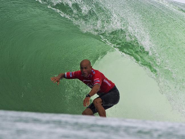 Kelly Slater again dominated the opening day of the Quiksilver Pro at Snapper Rocks in Queensland Australia. The event champion and current world champion caught this wave in his round one and negotiated a big barrel ride successfully to post the day