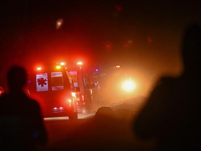 Ambulances carrying rescued workers leave the tunnel site after emergency and rescue teams safely brought out all trapped workers from the collapsed Silkyara tunnel. Picture: AFP