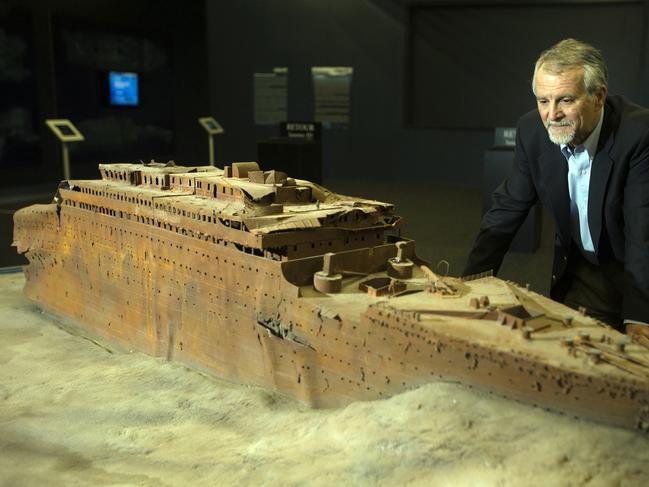 Paul-Henry Nargeolet, director of a deep ocean research project dedicated to the Titanic, poses next to a miniature version of the sunken ship. Picture: AFP