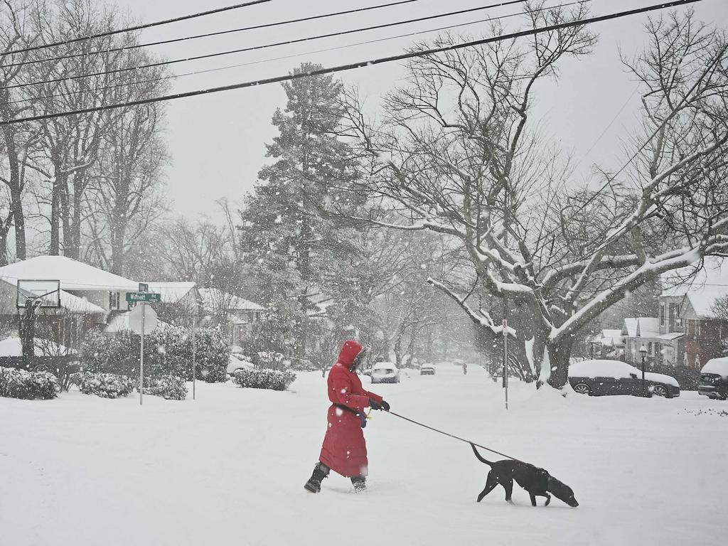 A pedestrian crosses the street during the winter storm in Bethesda, Maryland. Picture: PEDRO UGARTE / AFP