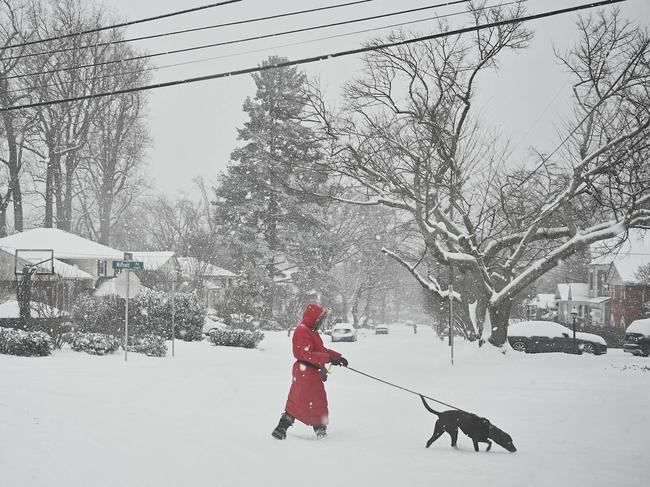 A pedestrian crosses the street during the winter storm in Bethesda, Maryland. Picture: PEDRO UGARTE / AFP