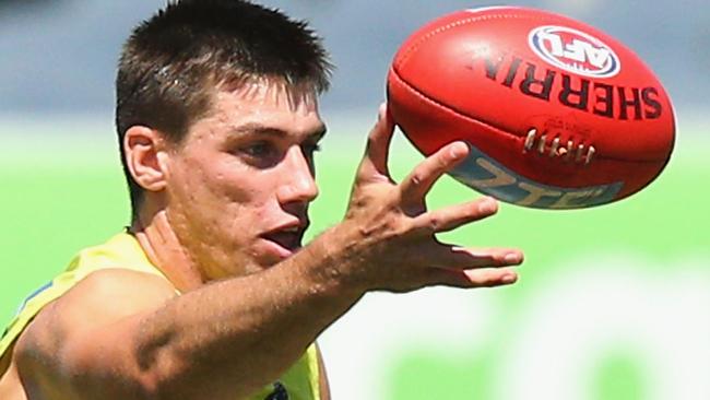 Matthew Kreuzer taps the ball during a Carltonn training session at Visy Park. Picture: Michael Dodge (Getty Images)