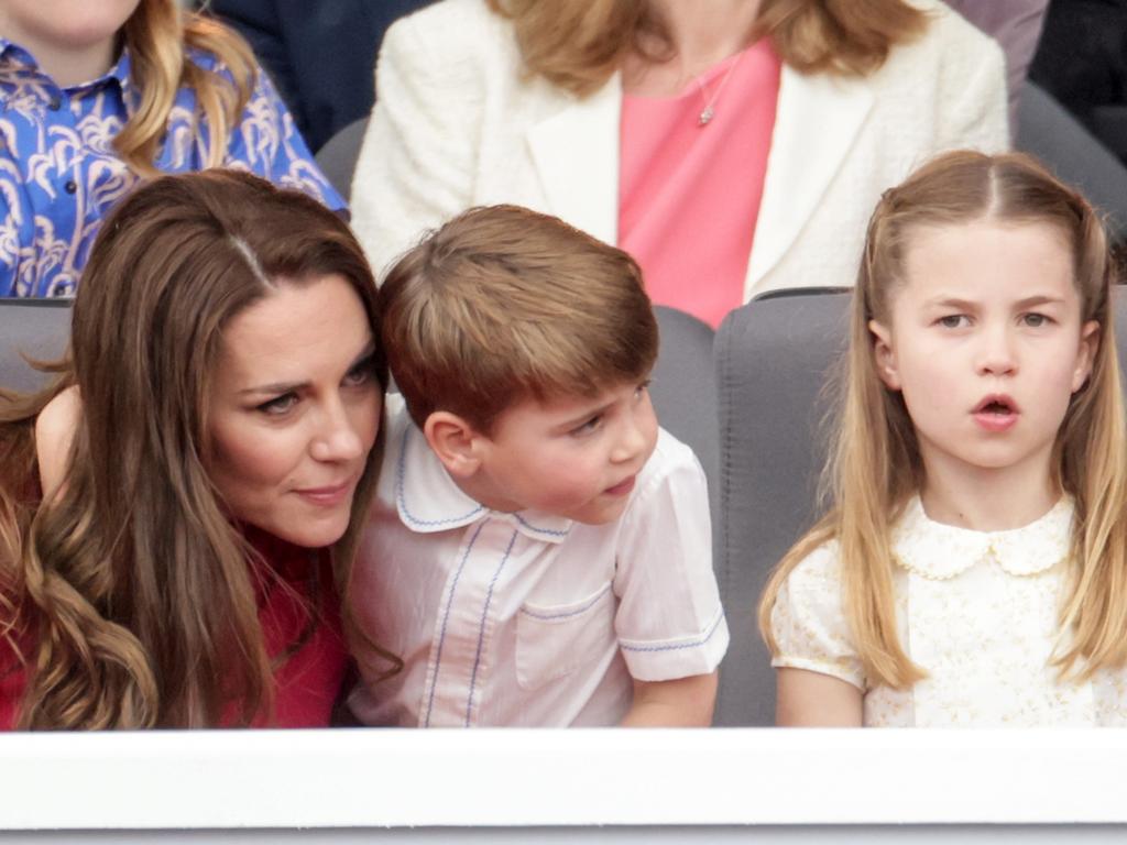 Princess Charlotte behaves while Prince Louis clings to his mum. Picture: Getty Images