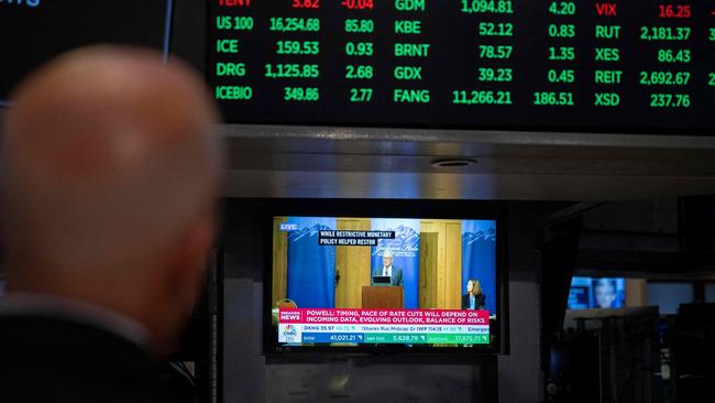 A television station broadcasts US Federal Reserve chair Jerome Powell speaking in Jackson Hole, Wyoming, on the floor of the New York Stock Exchange (NYSE). PIcture: AFP