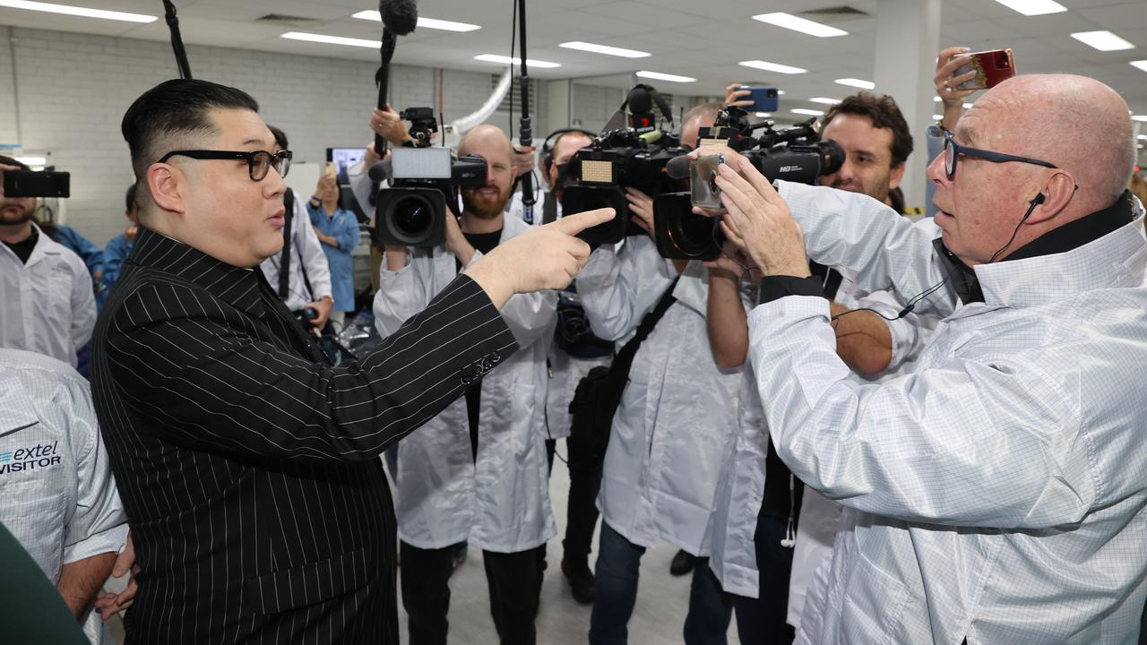 A man dressed as Kim Jong-un and calling himself the ‘Supreme Leader’ pushes his way into a technology manufacturing business where the PM had held a campaign event. Picture: Jason Edwards