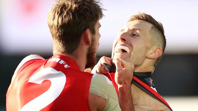 Sydney’s Kaiden Brand and Essendon’s Shaun McKernan get acquainted.