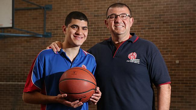 Elias Habelrith, pictured with son Richard, has been coaching the Special Olympics Eastern Sydney Team for 11 years, and has just been named Team NSW basketball coach. Picture:AAP IMAGE/ Danny Aarons.