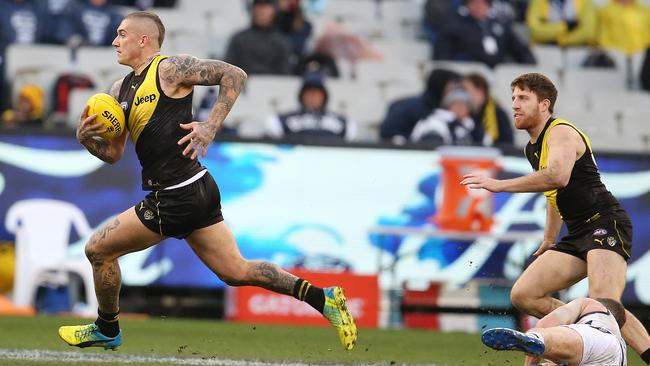 Richmond’s Dustin Martin charges forward during the Tigers’ win over Geelong at the MCG yesterday. Picture: Michael Klein