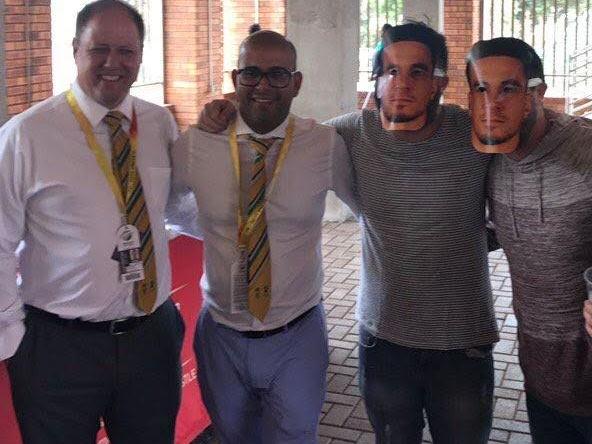Clive Eksteen and Altaaf Khazi with masked fans.
