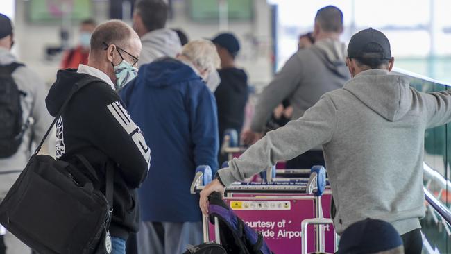 Passengers at Adelaide Airport recently. South Australia has now closed its borders to anyone who has been in the Waverley Council area. Picture: NCA NewsWire/Roy VanDerVegt