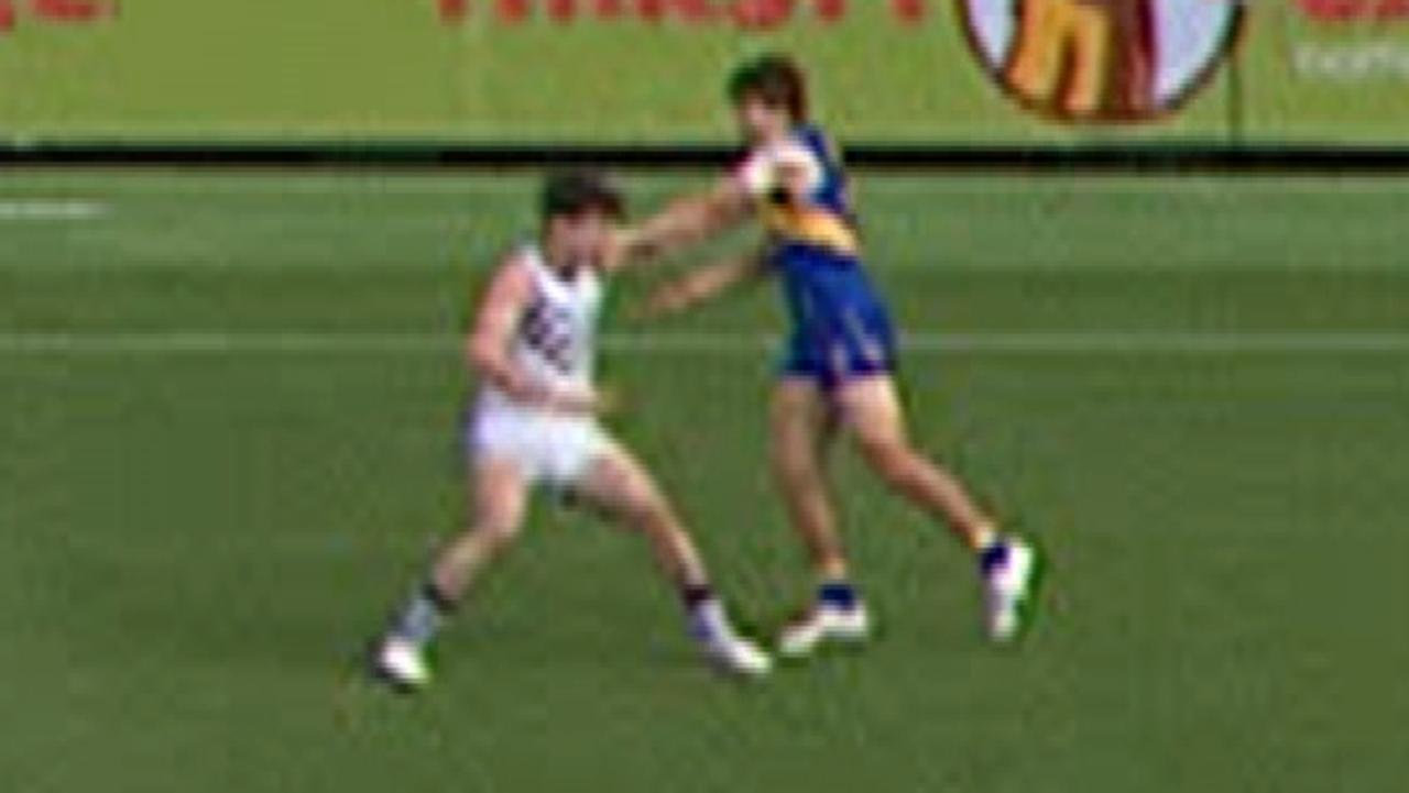 West Coast's Andrew Gaff punches Fremantle's Andrew Brayshaw in the face.