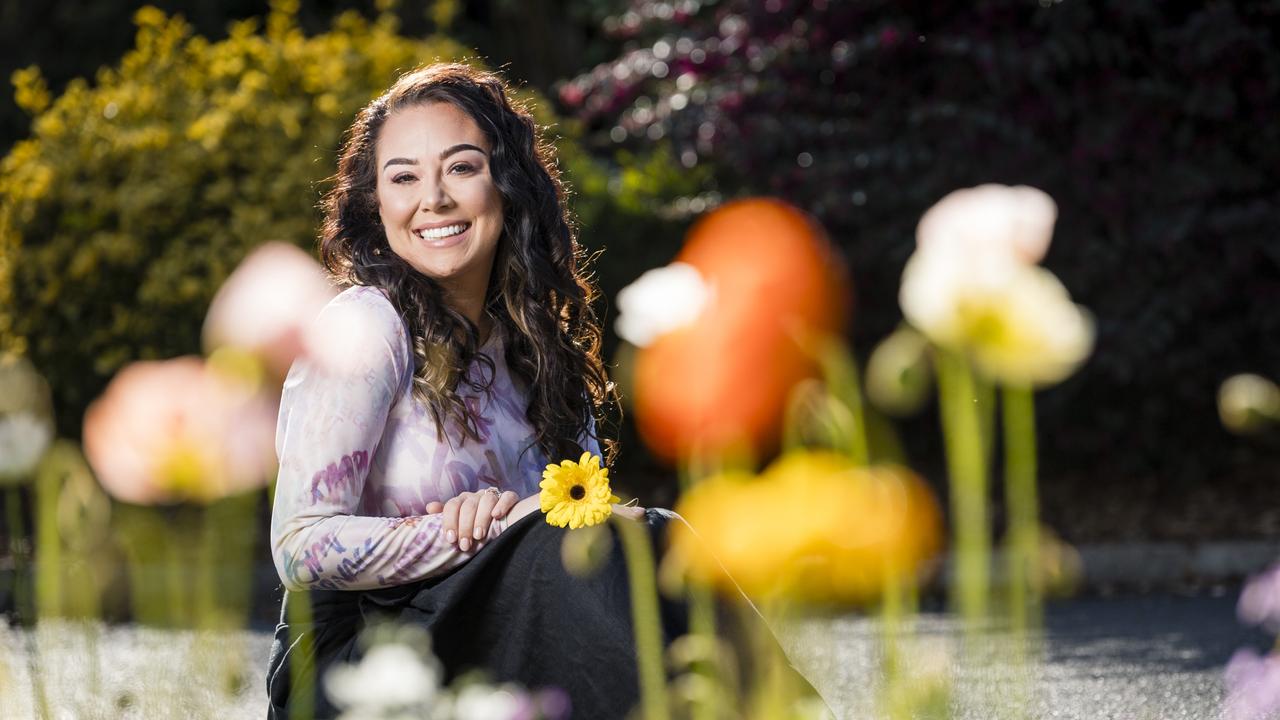 Cat Ardi Brennan checks out the magnificent floral display in Queens Park Botanic Gardens for Carnival of Flowers, Thursday, August 31, 2023. Picture: Kevin Farmer