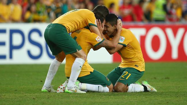 SYDNEY, AUSTRALIA - JANUARY 31: Matt McKay, James Troisi and Massimo Luongo of Australia celebrate victory during the 2015 Asian Cup final match between Korea Republic and the Australian Socceroos at ANZ Stadium on January 31, 2015 in Sydney, Australia. (Photo by Mark Kolbe/Getty Images)