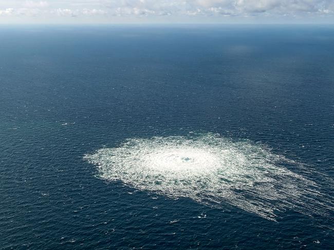 (FILES) In this file photo taken on September 27, 2022 this handout picture released by the Danish Defence Command shows the gas leak at the Nord Stream 2 gas pipeline as it is seen from the Danish Defence's F-16 rejection response off the Danish Baltic island of Bornholm, south of Dueodde. - US officials have seen new intelligence that indicates a 