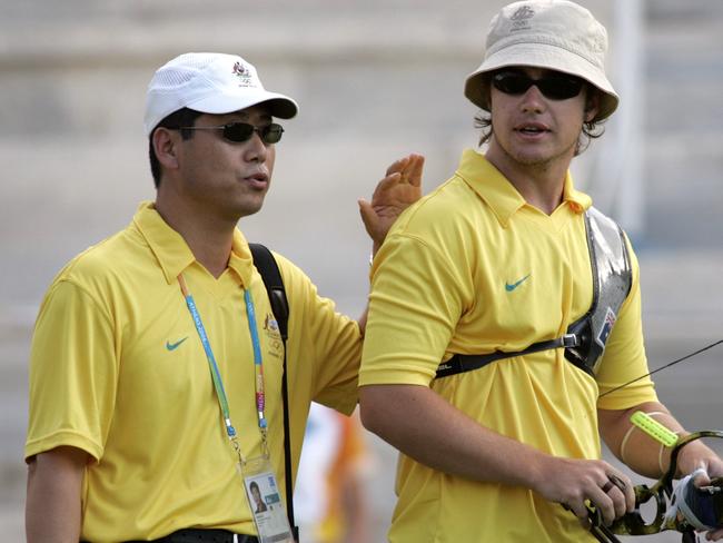 Archery - Aust archer Tim Cuddihy being congratulated by coach Ki Sik Lee after advancing to men's individual final at 2004 Athens Olympic Games 18 Aug 2004.