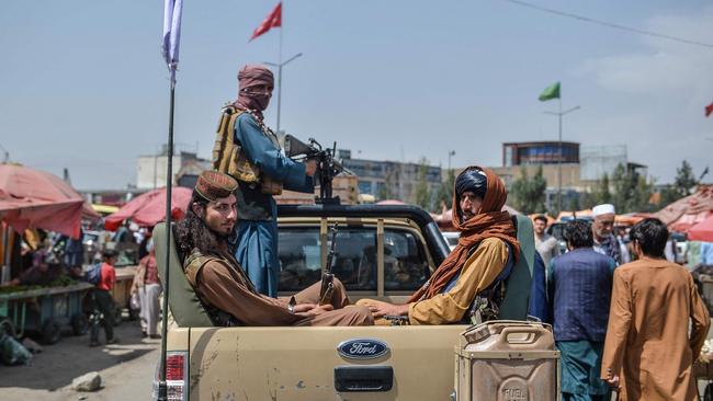 Taliban fighters in a market area of Kabul on Tuesday. Picture: AFP