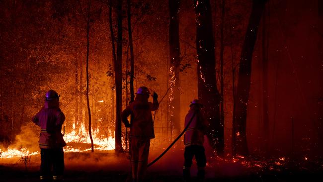 Rural Fire Services attack a fire in Sussex Inlet on the South Coast on New Year’s Eve. (Photo by Sam Mooy/Getty Images)