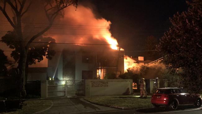 Firefighters battling an out-of-control house fire on Rennison St, Beaumaris. Picture: James Mottershead