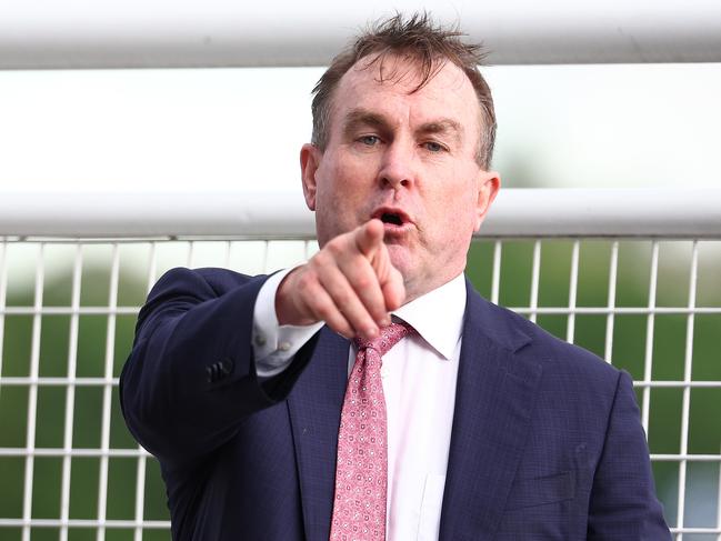 SYDNEY, AUSTRALIA - DECEMBER 26: Trainer John O'Shea celebrates after Tyler Schiller riding Lion's Roar wins Race 7 Schweppes Summer Cup during Sydney Racing at Royal Randwick Racecourse on December 26, 2023 in Sydney, Australia. (Photo by Jeremy Ng/Getty Images)