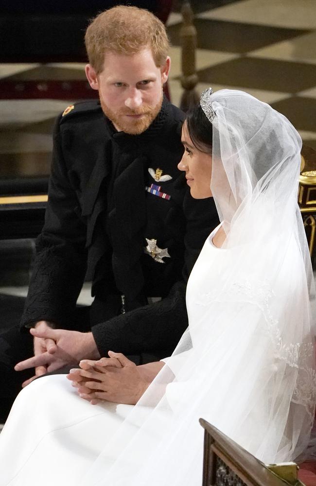 Prince Harry struggled to stay composed during the wedding ceremony, Meghan Markle had no such problems. Picture: AP