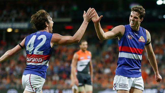 Zaine Cordy (right) celebrates a goal with Liam Picken.