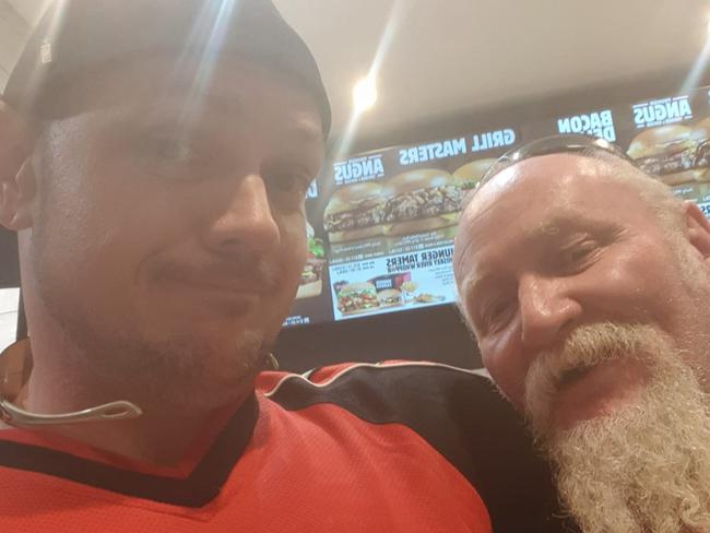 Zak Grieve, pictured with his dad, topped off his first day free with some Hungry Jacks. Picture: Supplied