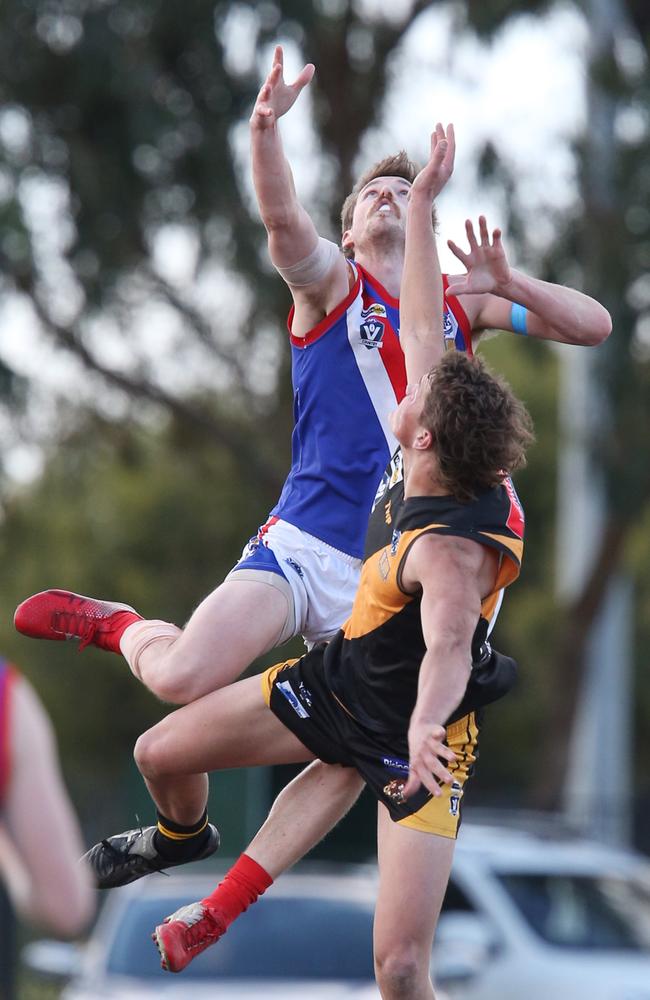 Grovedale’s Brady Ferguson has South Barwon’s Luke Davis leap over him. Picture: Mark Wilson