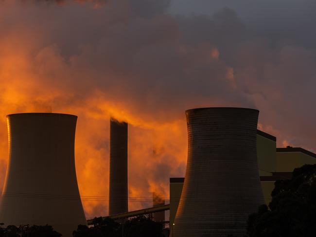 TRARALGON, AUSTRALIA - AUGUST 17: A general view of the Loy Yang power plants as the sun rises on August 17, 2022 in Traralgon, Australia. The Greens will introduce a bill to state parliament this week proposing the closure of Victoria's remaining coal plants - Yallourn, Loy Yang A, and Loy Yang B - by 2030 ahead of the current plan for decommissioning by 2046. (Photo by Asanka Ratnayake/Getty Images)