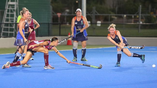 Norths Jamie Lee Surha, left, uses her reach to try and block a rival.