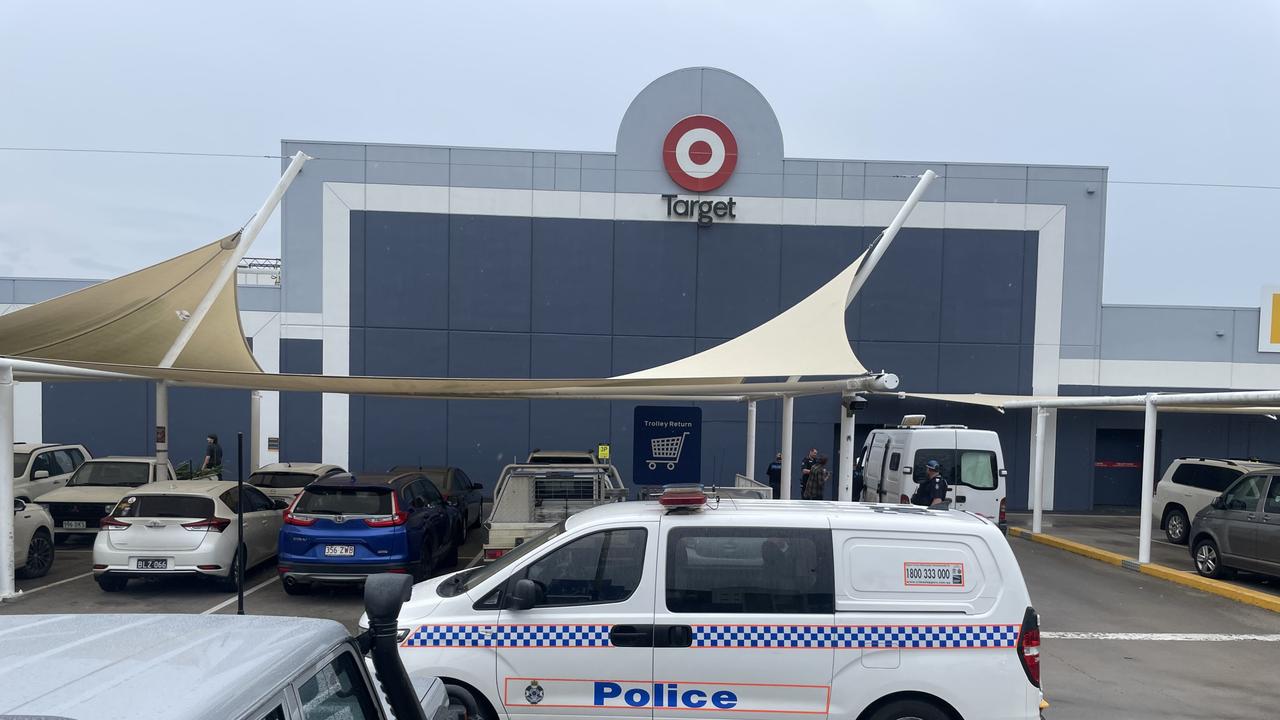 Police units swarm to City Centre Plaza after reports of a man armed with a large knife.