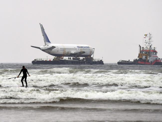 ONA paddle boarder is seen as Boeing 767 aeroplane arrives the Enniscrone estuary. Picture: Reuters