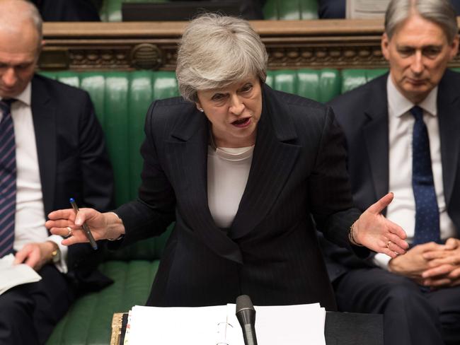 A handout photograph taken and released by the UK Parliament on May 22, 2019 shows Britain's Prime Minister Theresa May during the weekly Prime Minister's Questions (PMQs) question and answer session in the House of Commons in London. (Photo by MARK DUFFY / various sources / AFP) / EDITORS NOTE THE IMAGE HAS BEEN DIGITALLY ALTERED AT SOURCE TO OBSCURE VISIBLE DOCUMENTS  - RESTRICTED TO EDITORIAL USE - NO USE FOR ENTERTAINMENT, SATIRICAL, ADVERTISING PURPOSES - MANDATORY CREDIT " AFP PHOTO /MARK DUFFY/ UK Parliament"